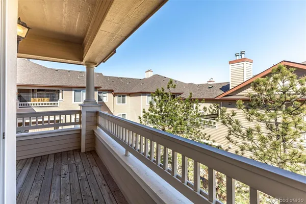 a view of balcony with furniture