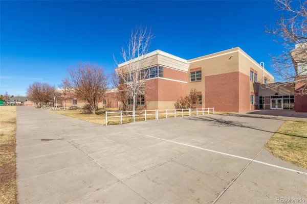 a view of a building with a street