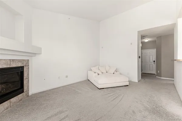 a room with a bed and a fireplace