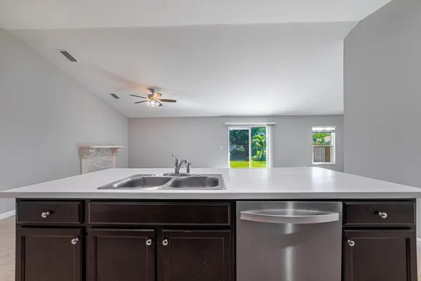 a kitchen with a sink and a window