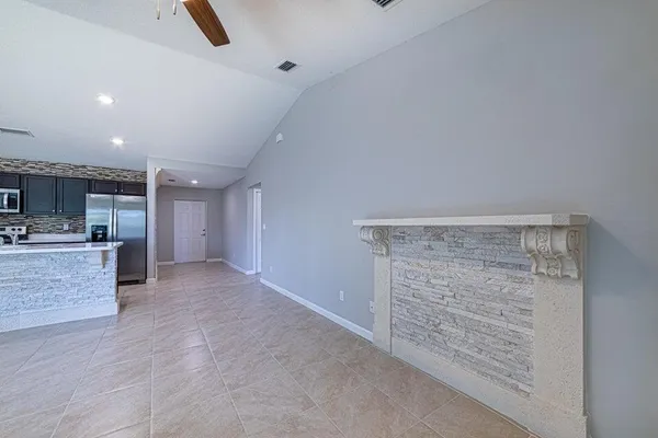 a view of kitchen with cabinets