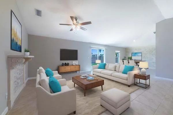 a living room with furniture and a flat screen tv