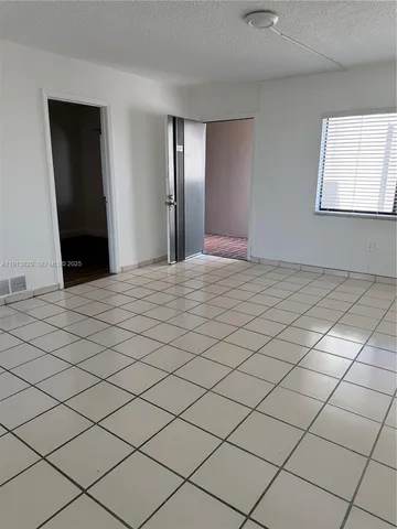 a view of a livingroom and window