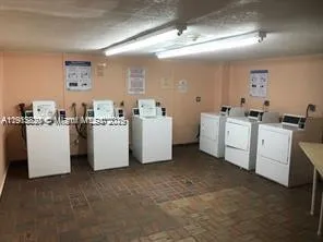 a living room with furniture a table tennis table and a window