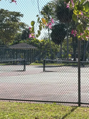 a living room with furniture a table tennis table and a window