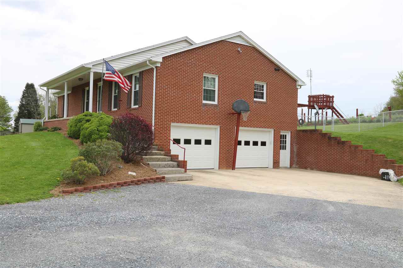 1938 Middlebrook Road Staunton, VA 24401 - Photo 2 of 38 a front view of a house with a yard and garage