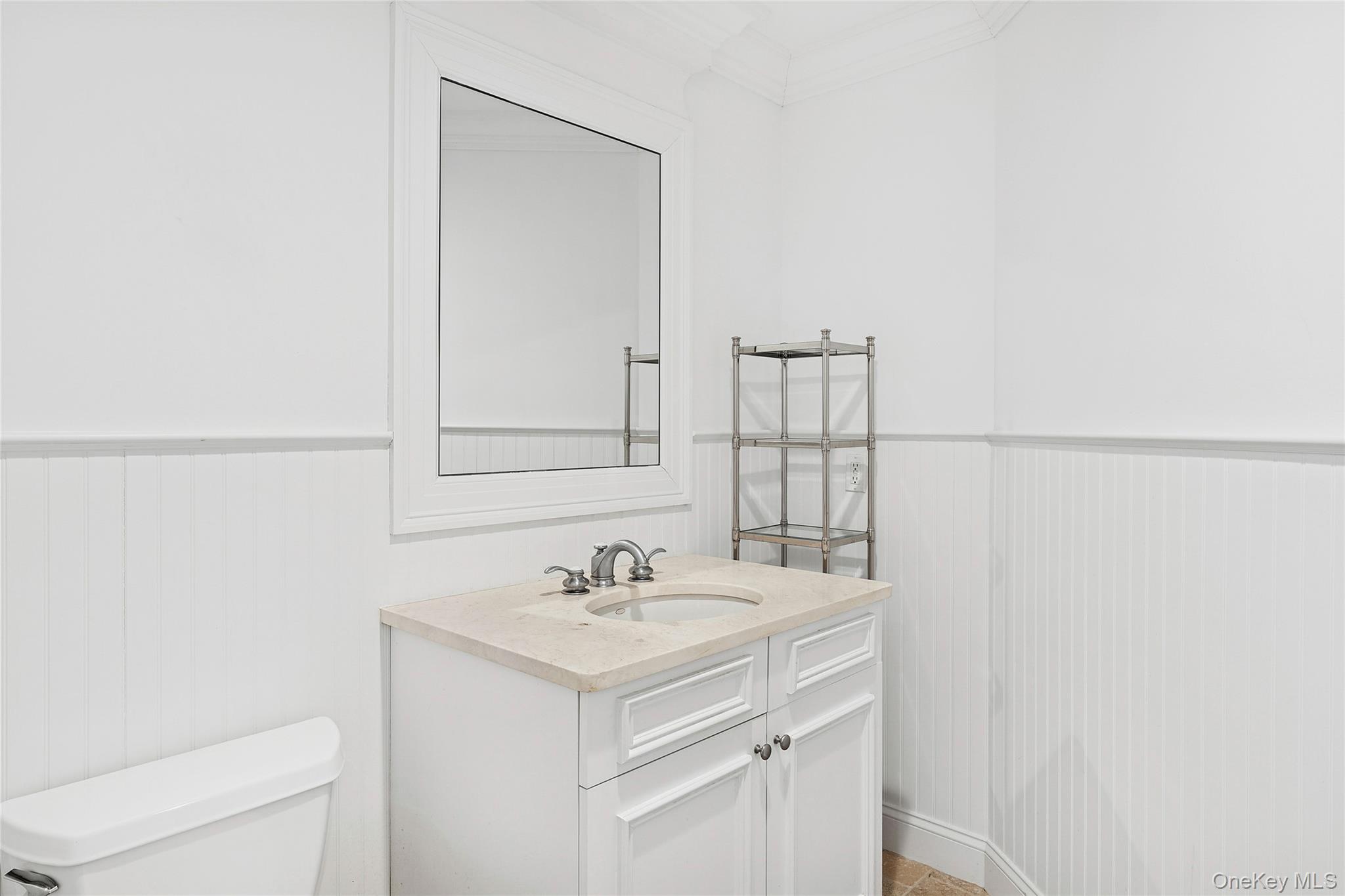 122 Beach Road Westhampton Beach, NY 11978 - Photo 12 of 18 a bathroom with a sink and a toilet