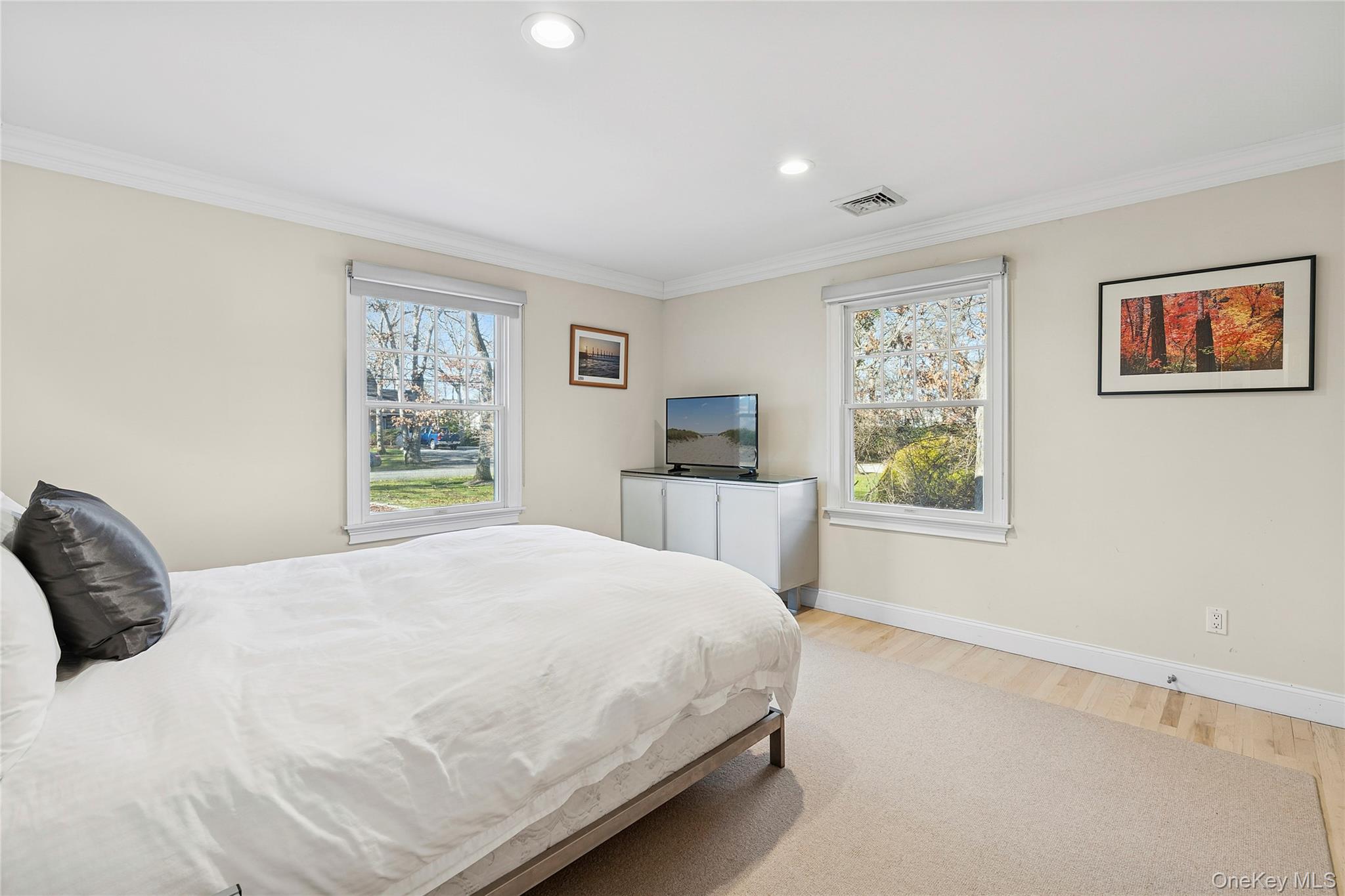 122 Beach Road Westhampton Beach, NY 11978 - Photo 14 of 18 a bedroom with a bed and a window