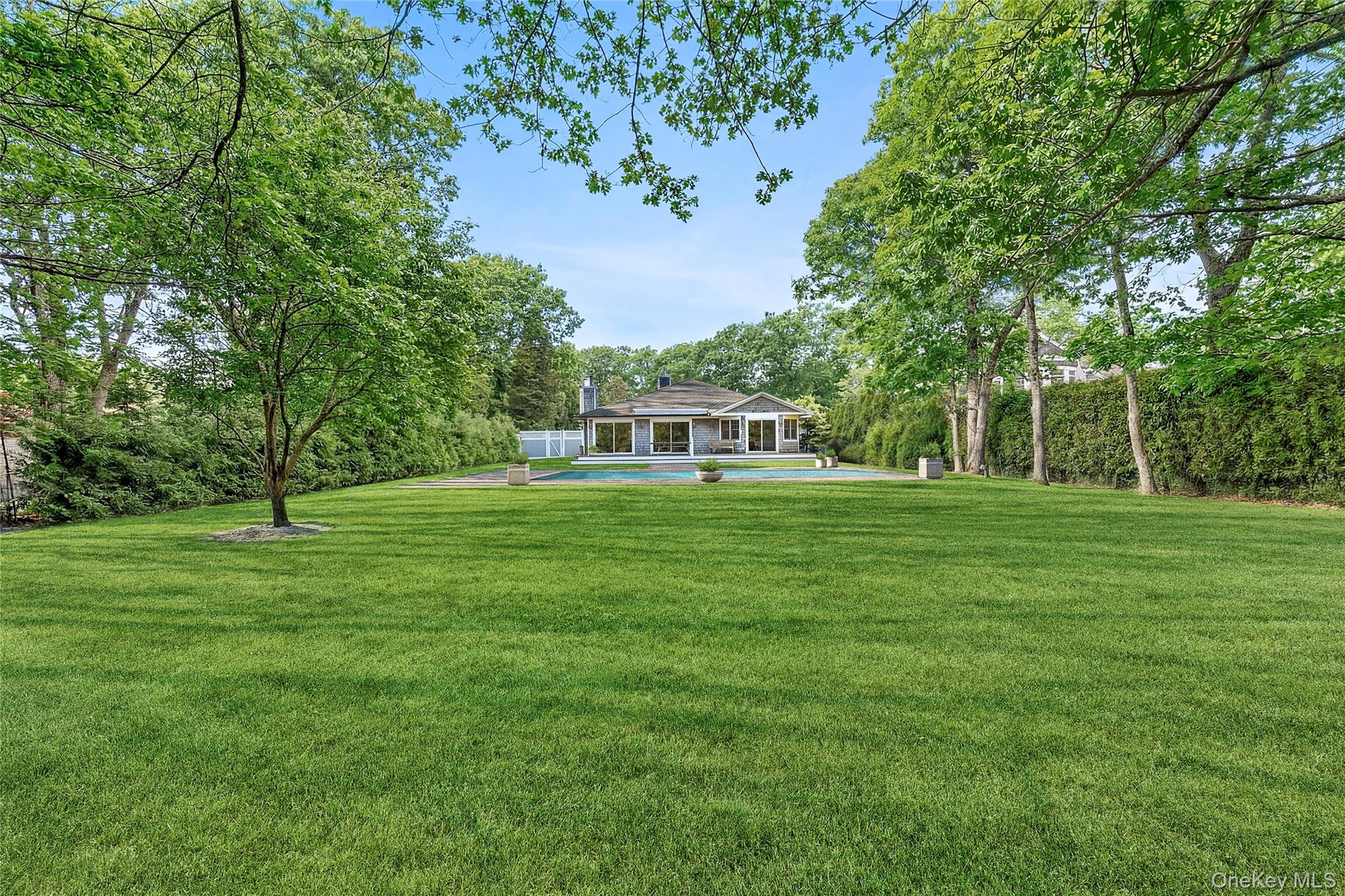 122 Beach Road Westhampton Beach, NY 11978 - Photo 18 of 18 a view of a house with a big yard