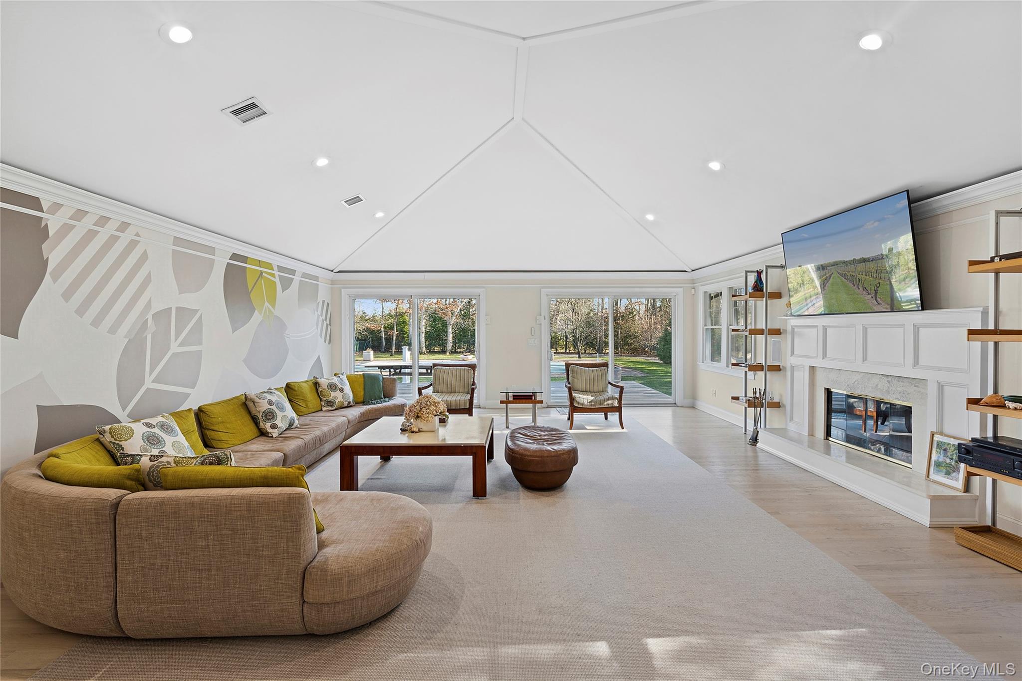 122 Beach Road Westhampton Beach, NY 11978 - Photo 3 of 18 a living room with fireplace furniture and a large window