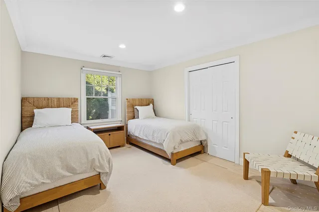 a bedroom with two beds and painted walls