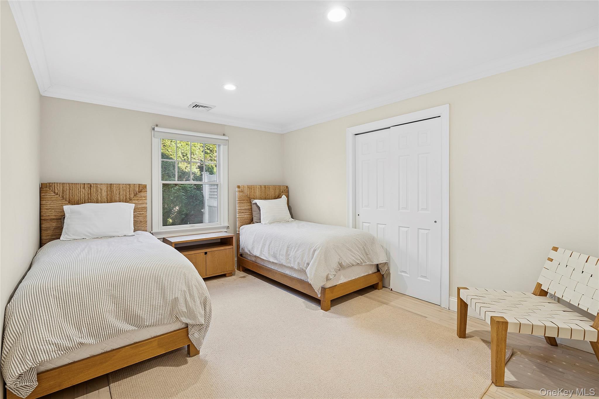 122 Beach Road Westhampton Beach, NY 11978 - Photo 9 of 18 a bedroom with two beds and painted walls