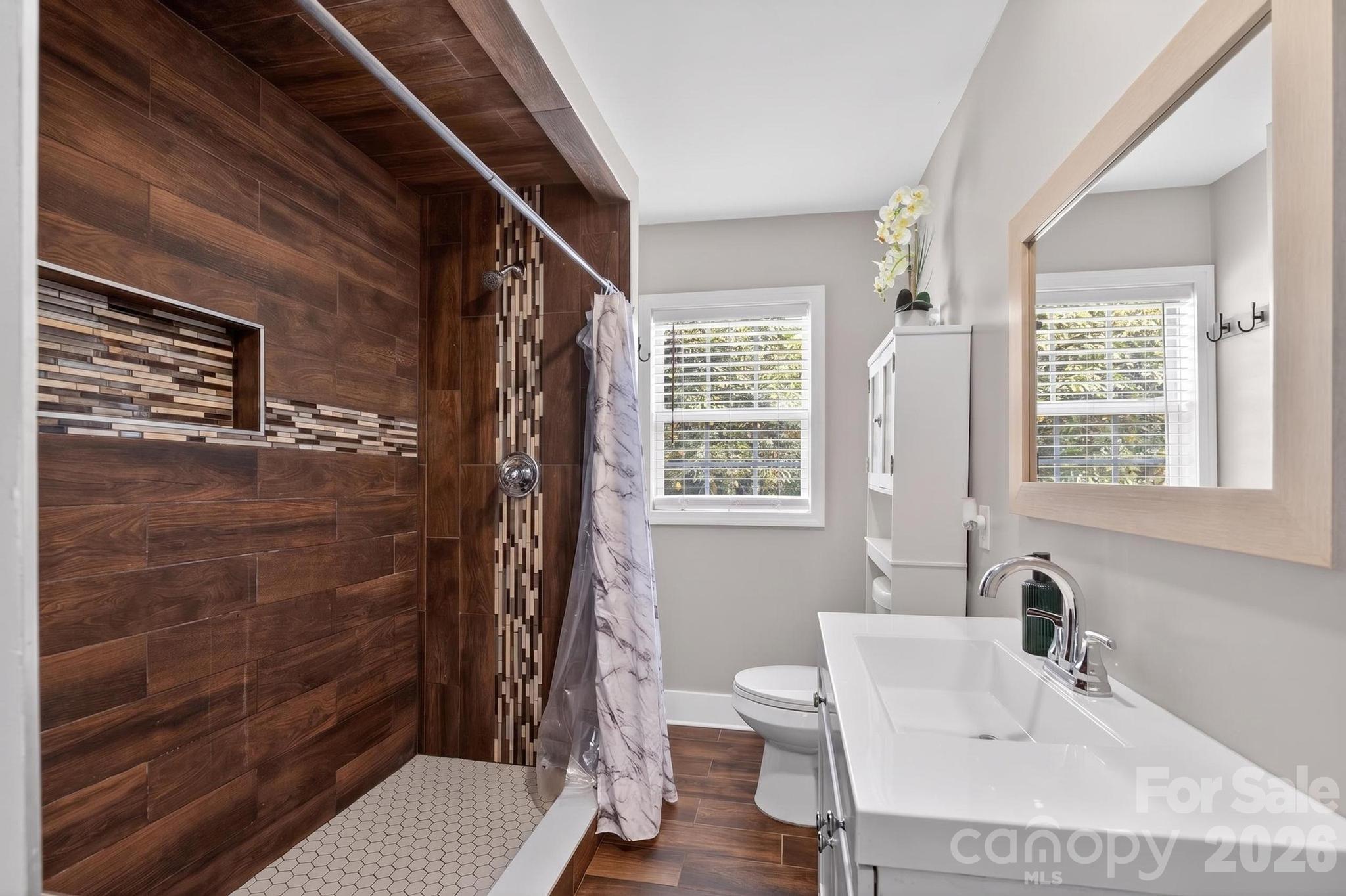 2076 Connelly Springs Road Lenoir, NC 28645 - Photo 22 of 47 a bathroom with a sink toilet and shower