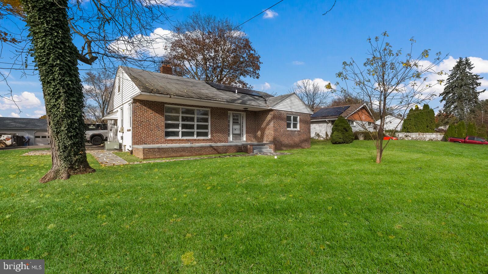 a view of a house with a yard porch and sitting area