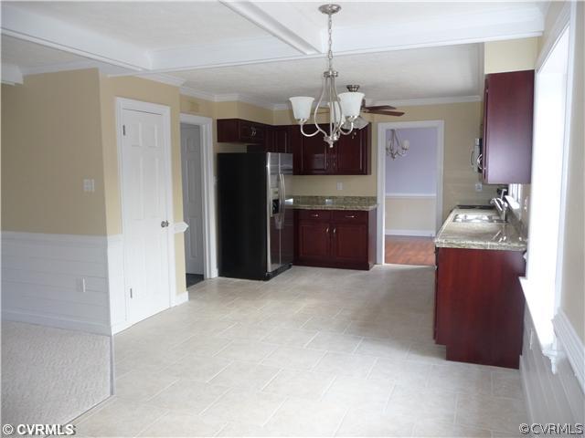 13811 Barnes Spring Road Midlothian, VA 23112 - Photo 3 of 12 a open kitchen with refrigerator and stove top oven