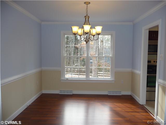 13811 Barnes Spring Road Midlothian, VA 23112 - Photo 5 of 12 a view of a big room with wooden floor and windows