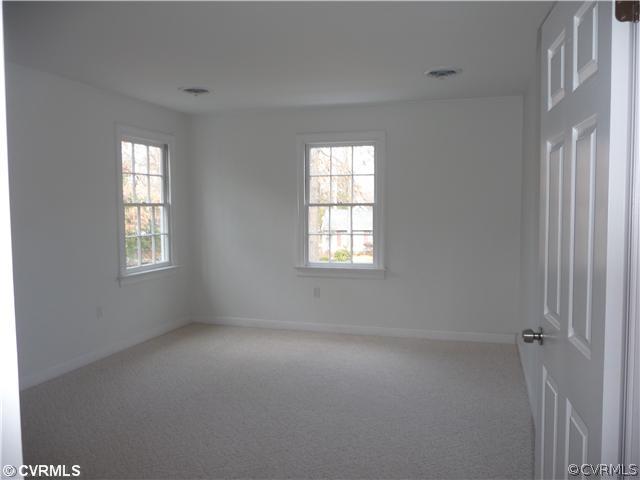 13811 Barnes Spring Road Midlothian, VA 23112 - Photo 7 of 12 an empty room with windows