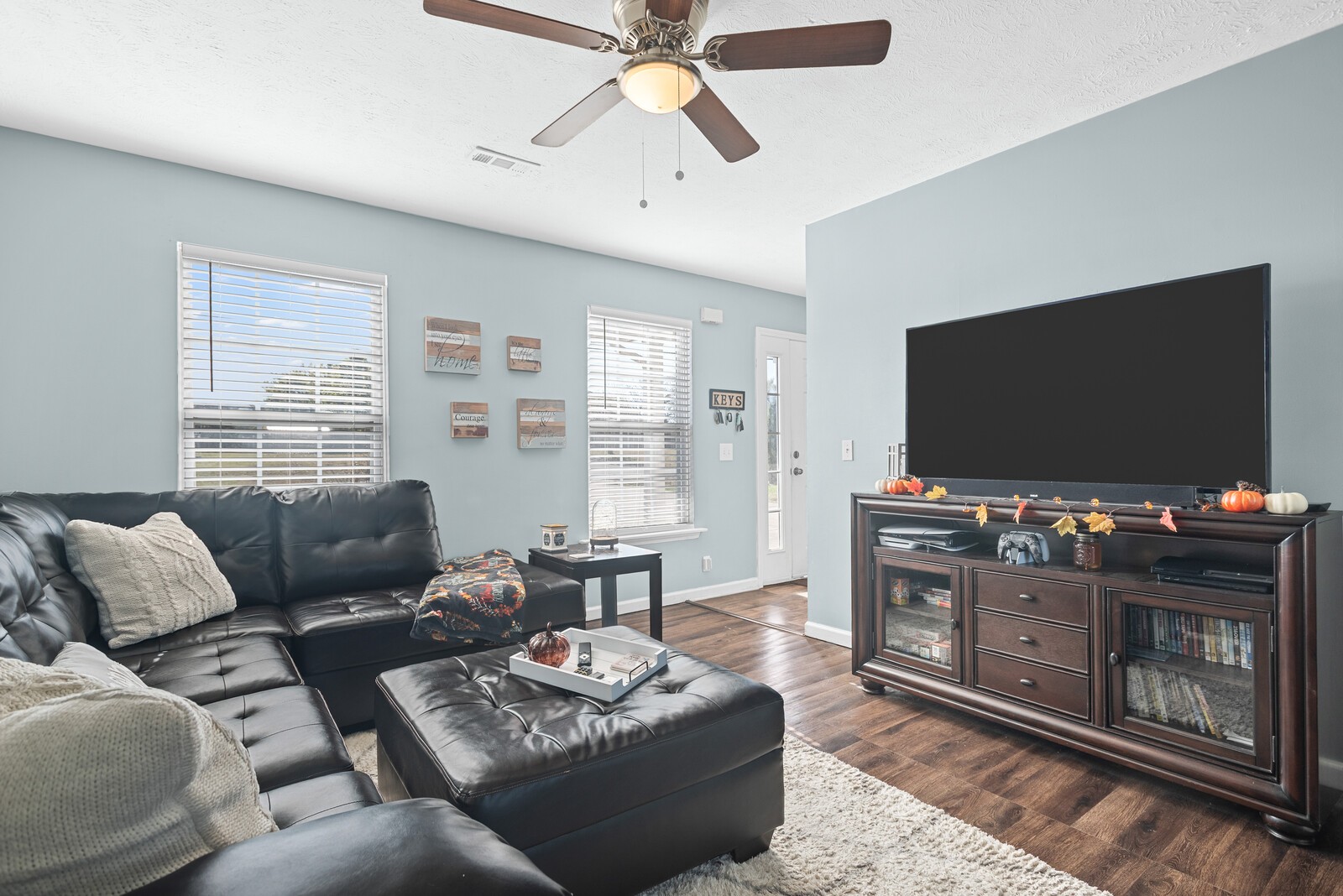 1413 Fall Parkway Murfreesboro, TN 37129 - Photo 12 of 48 a living room with furniture and a flat screen tv