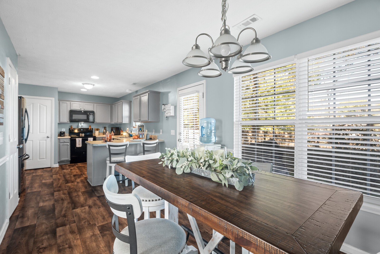 1413 Fall Parkway Murfreesboro, TN 37129 - Photo 16 of 48 a view of a dining room and kitchen with furniture wooden floor and chandelier