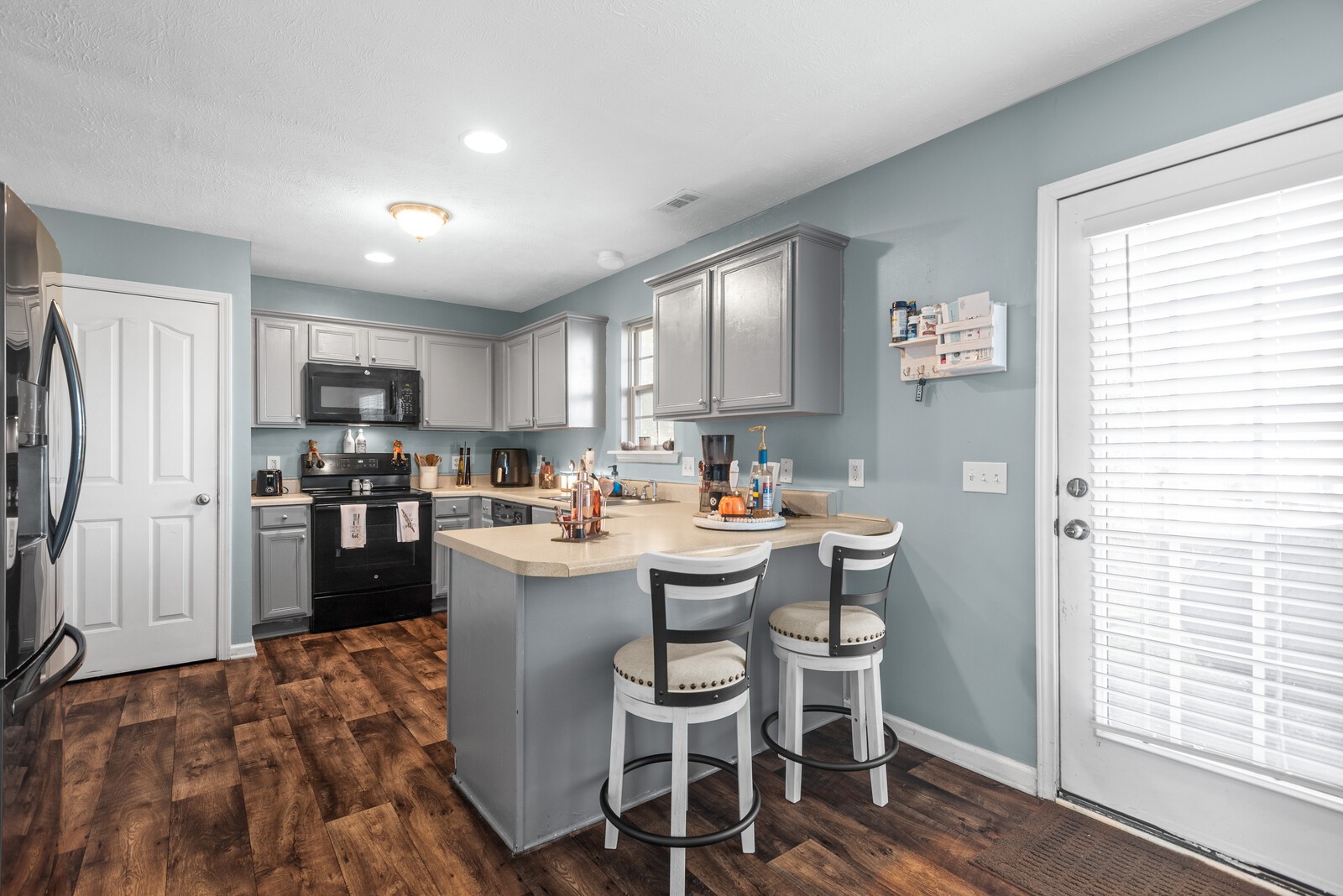 1413 Fall Parkway Murfreesboro, TN 37129 - Photo 17 of 48 a kitchen with a sink and chairs