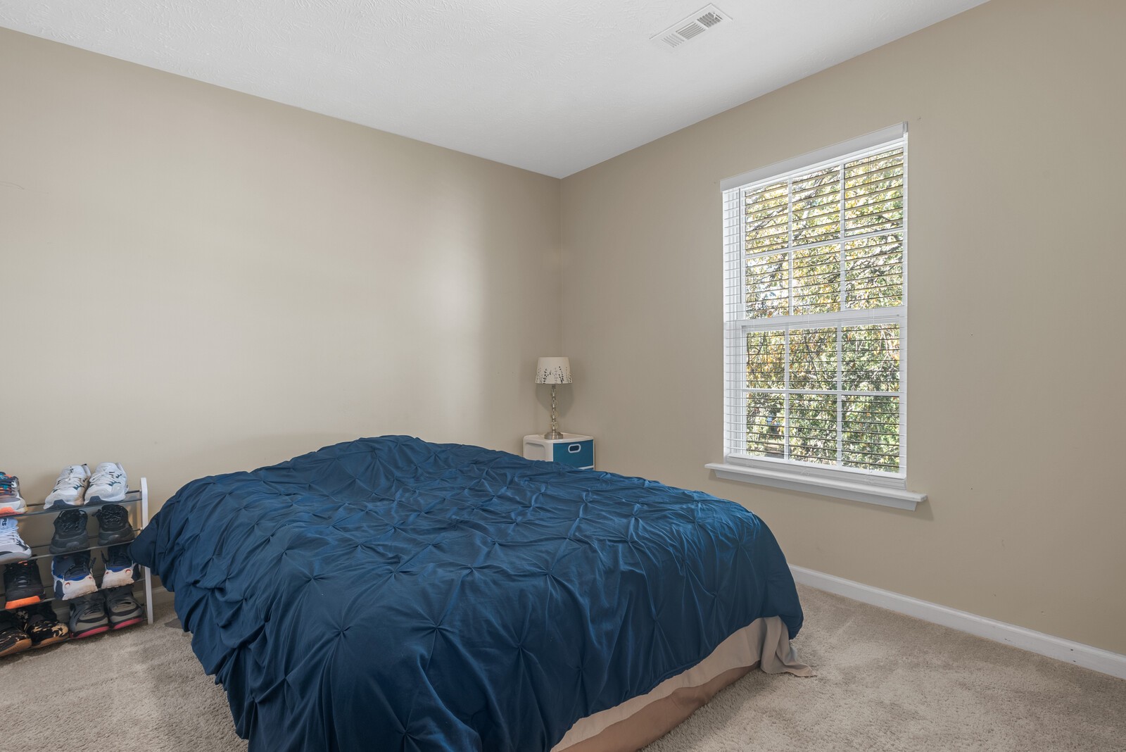 1413 Fall Parkway Murfreesboro, TN 37129 - Photo 27 of 48 a bed sitting in a bedroom next to a window