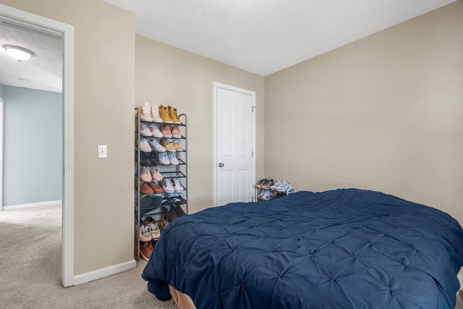 1413 Fall Parkway Murfreesboro, TN 37129 - Photo 28 of 48 a bedroom with a bed and a book shelf