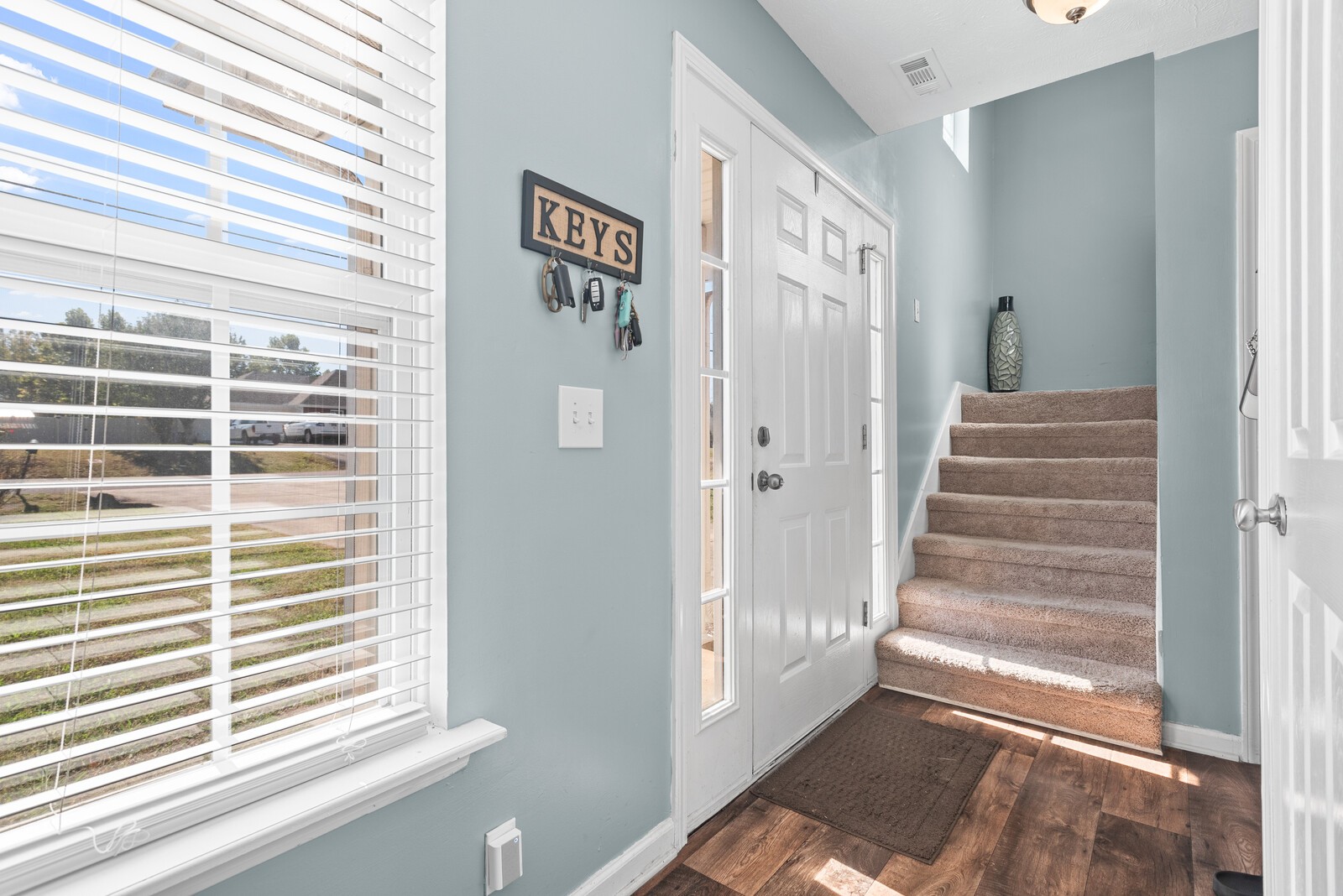 1413 Fall Parkway Murfreesboro, TN 37129 - Photo 7 of 48 a view of a hallway with windows and stairs