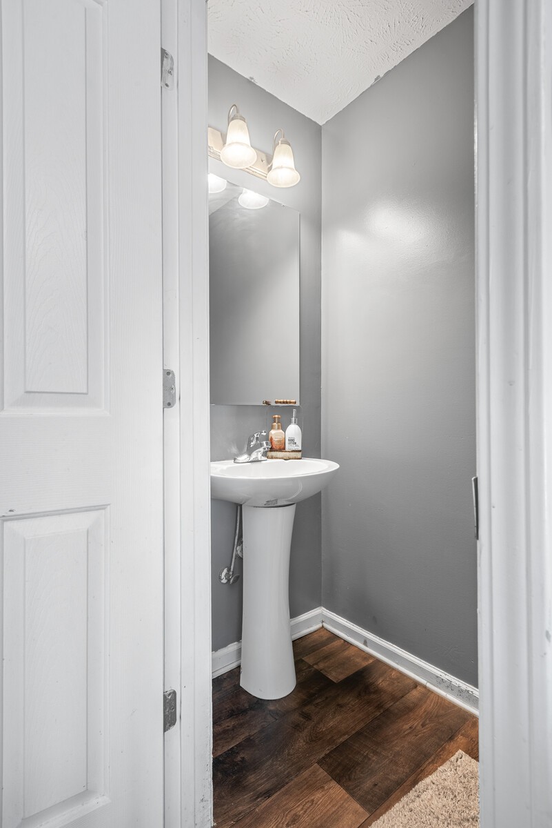 1413 Fall Parkway Murfreesboro, TN 37129 - Photo 9 of 48 a bathroom with a sink and mirror