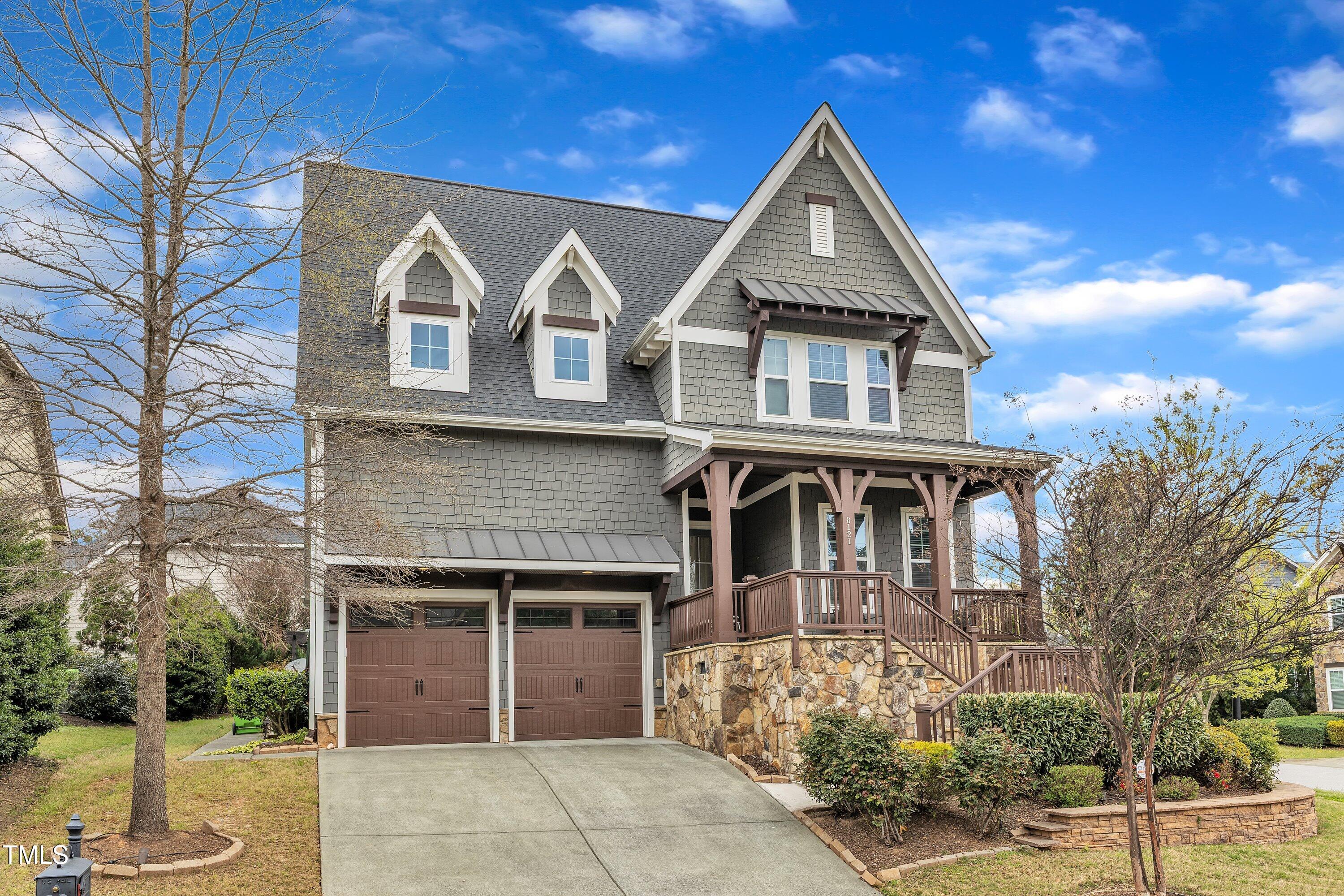 8121 Greys Landing Way Raleigh, NC 27615 - Photo 7 of 95 a front view of a house with garden
