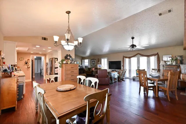 a living room with furniture or couch and a wooden floor