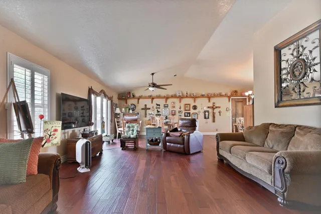 a bedroom with furniture window and wooden floor