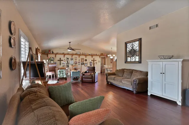 a bedroom with a large bed and a large window