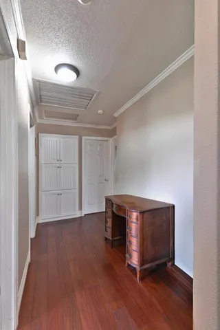 a bedroom with a bed and a ceiling fan