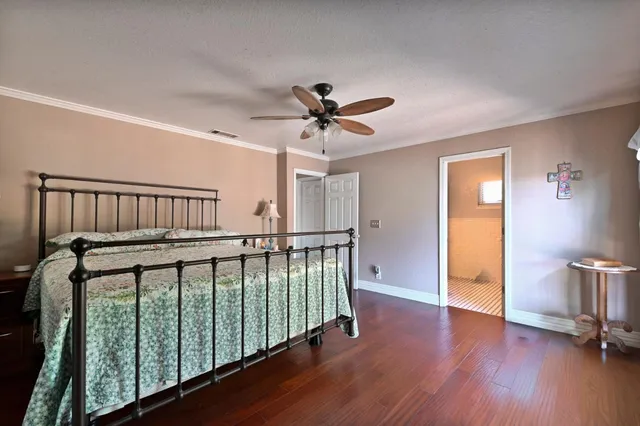 a bed room with a bed and a dresser