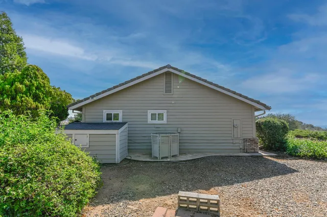 an aerial view of a house with a garden