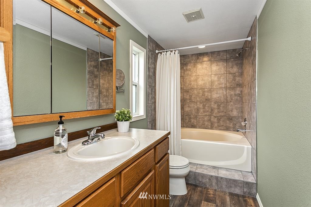 520 North Carpenter Road Snohomish, WA 98290 - Photo 13 of 25 a bathroom with a sink toilet and shower