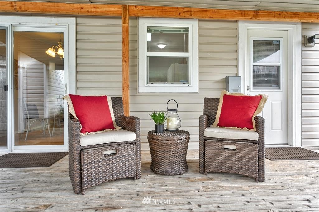 520 North Carpenter Road Snohomish, WA 98290 - Photo 17 of 25 a wooden bench sitting in front of a building