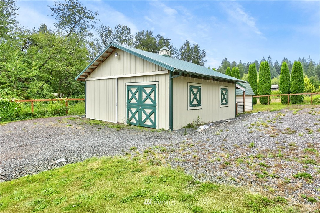 520 North Carpenter Road Snohomish, WA 98290 - Photo 20 of 25 a view of a house with a yard and garage