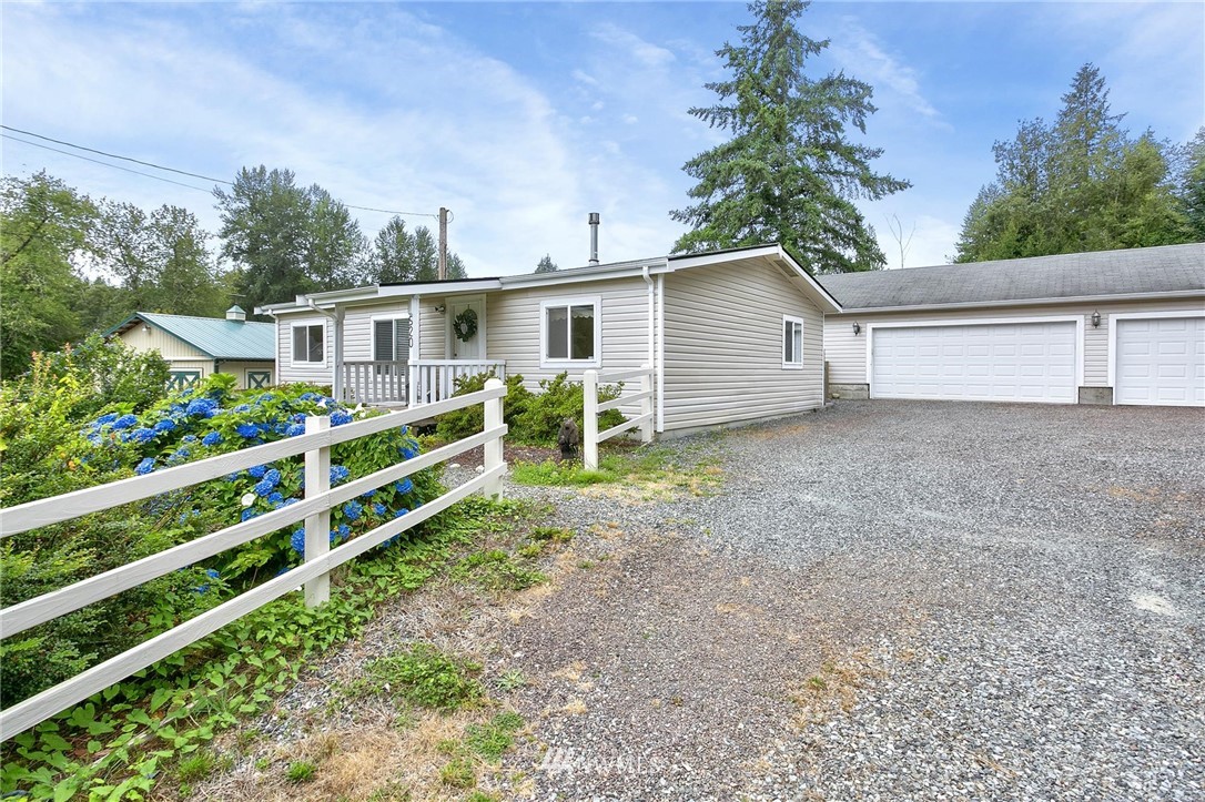 520 North Carpenter Road Snohomish, WA 98290 - Photo 3 of 25 a view of a house with a yard and plants
