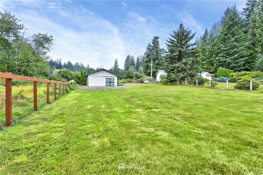 520 North Carpenter Road Snohomish, WA 98290 - Photo 21 of 25 a view of a house with a yard and sitting area