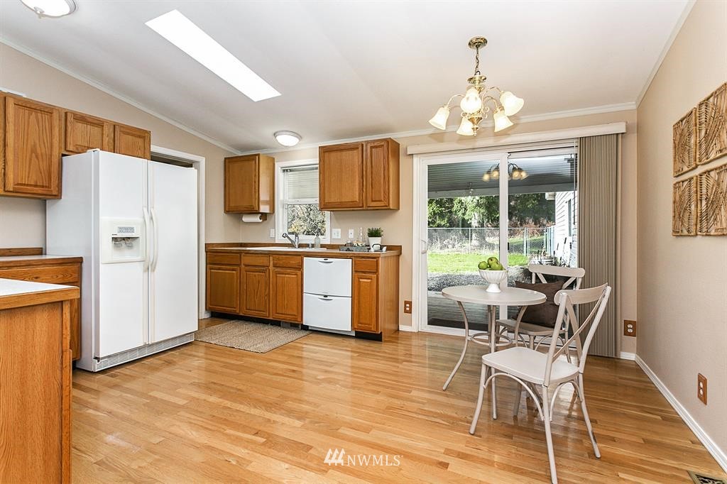 520 North Carpenter Road Snohomish, WA 98290 - Photo 7 of 25 a kitchen with stainless steel appliances granite countertop a refrigerator and a stove top oven
