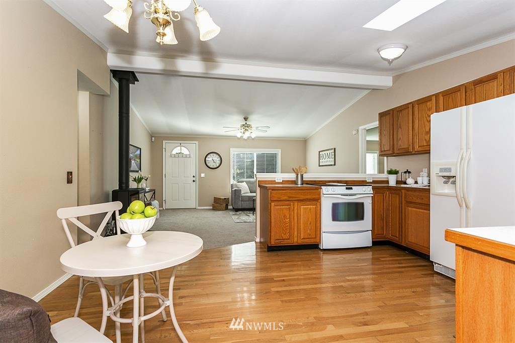 520 North Carpenter Road Snohomish, WA 98290 - Photo 8 of 25 a kitchen with a sink appliances and dining table