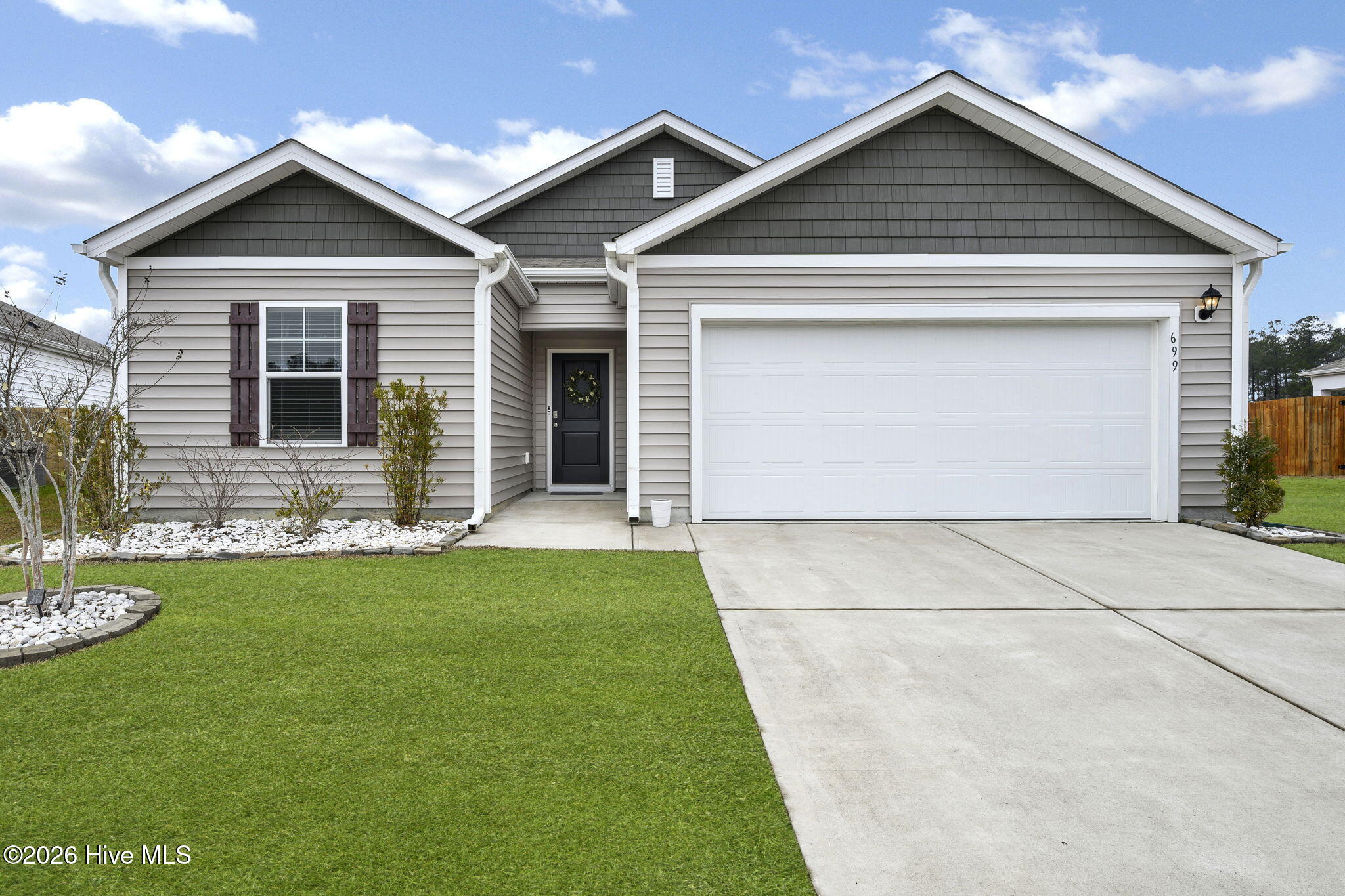 699 Buckeye Road Northeast Leland, NC 28451 - Photo 2 of 42 46-web-or-mls-Front exterior grass(2)