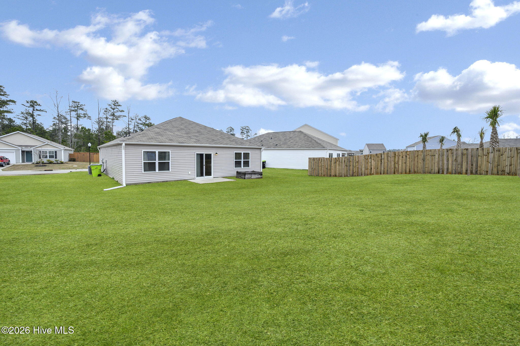 699 Buckeye Road Northeast Leland, NC 28451 - Photo 26 of 42 41-web-or-mls-Backyard grass(2)