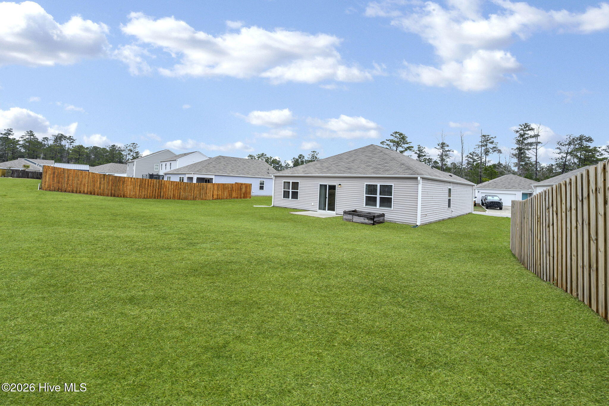 699 Buckeye Road Northeast Leland, NC 28451 - Photo 27 of 42 42-web-or-mls-Backyard grass(2)