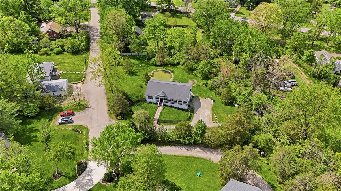 1208 Jarva Lane Springboro, OH 45066 - Photo 3 of 75 This tranquil property features a charming home amidst lush greenery, offering a private pond and expansive yard.