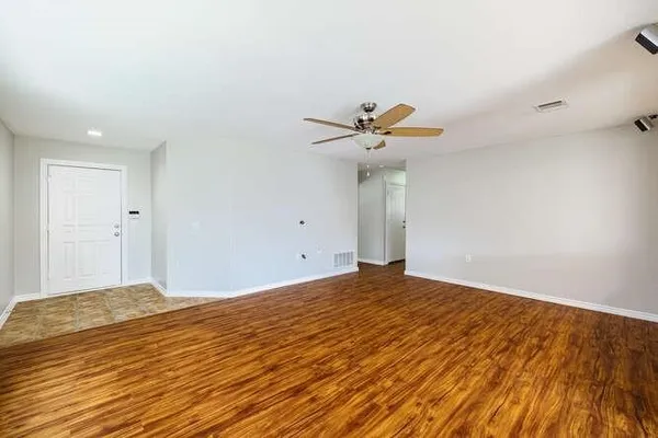a view of room with a ceiling fan
