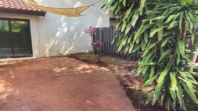 a backyard of a house with a trees