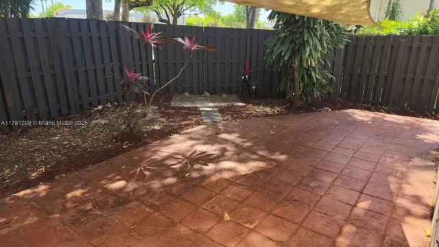 a view of swimming pool with a table and chairs
