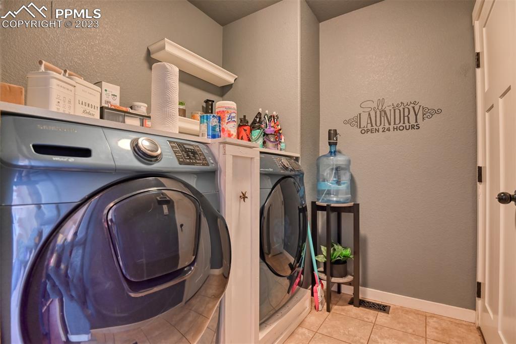9785 Terrain Road Fountain, CO 80817 - Photo 17 of 40 a utility room with dryer and washer